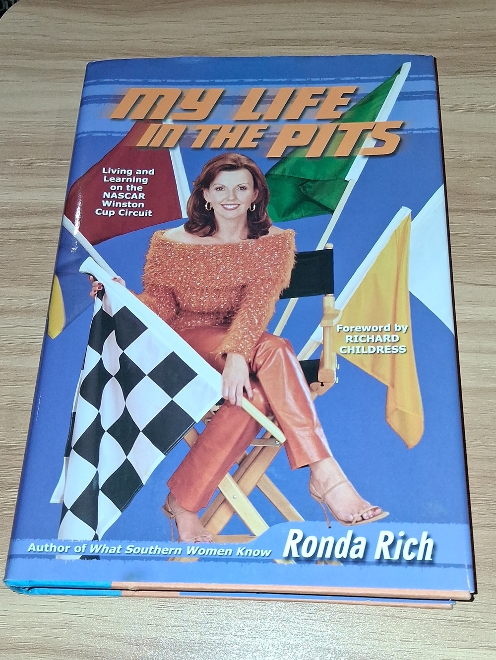Blue Racing-Themed Hardcover Book- Autobiography Of Ronda Rich.